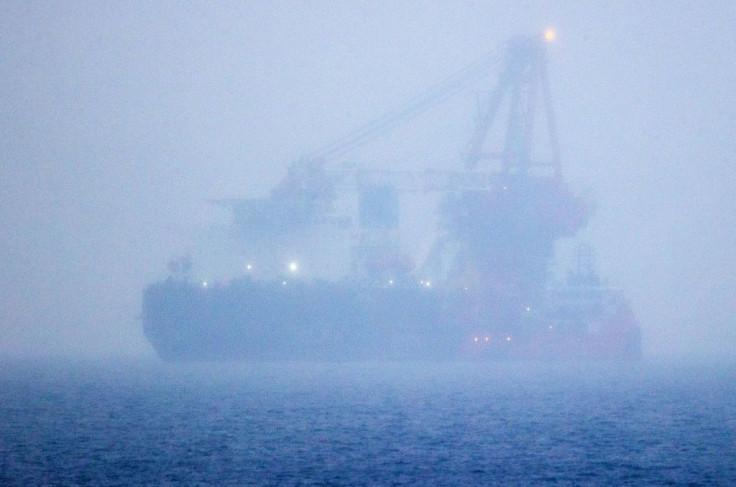 The Russian pipe-laying ship Fortuna, which has been hit by US sanctions, is seen in the fog anchored in the Baltic Sea off the port of Rostock in Germany in January 2021 during work on the controversial Nord Stream 2 gas pipeline