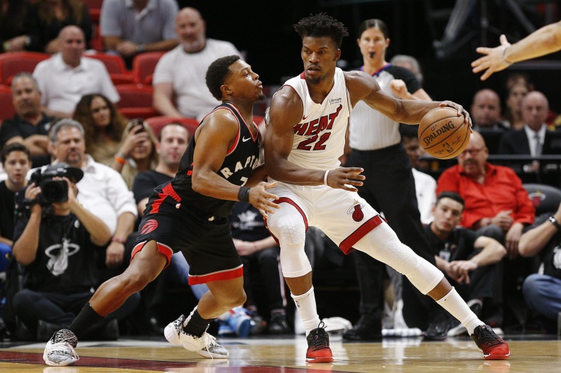 Jimmy Butler #22 of the Miami Heat drives to the basket against Kyle Lowry #7 of the Toronto Raptors