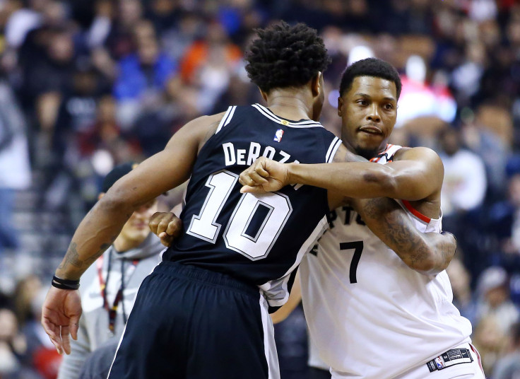 DeMar DeRozan #10 of the San Antonio Spurs hugs Kyle Lowry #7 of the Toronto Raptors