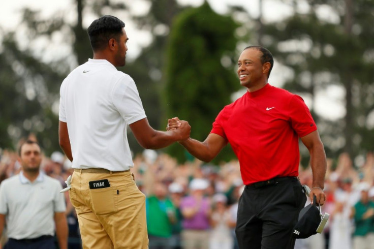 Tony Finau, at left congratulating Tiger Woods on winning the 2019 Masters, is among many PGA players who credit Woods with inspiring them to play golf