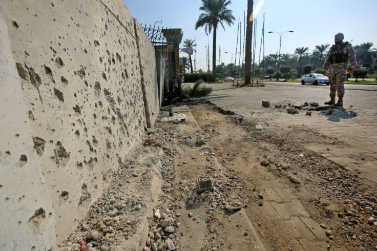 Damage outside the Zawraa park in Baghdad after a volley of rockets slammed into the Iraqi capital in mid-November
