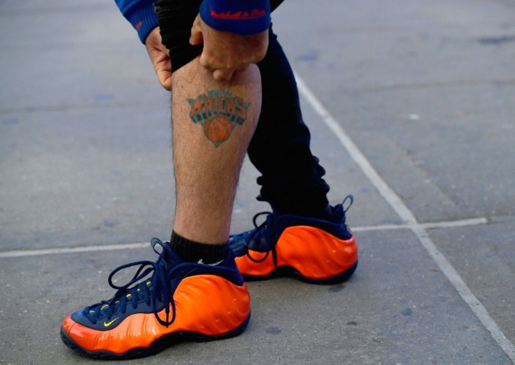 New York Knicks superfan Anthony Donahue shows his tattoo prior to the Knicks' game against Golden State Warriors at Madison Square Garden on February 23, 2021