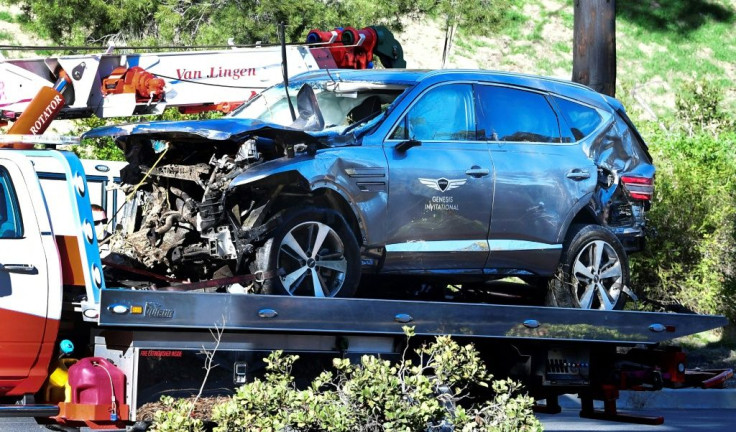 A tow truck holds the vehicle Tiger Woods drove in a crash that injured him