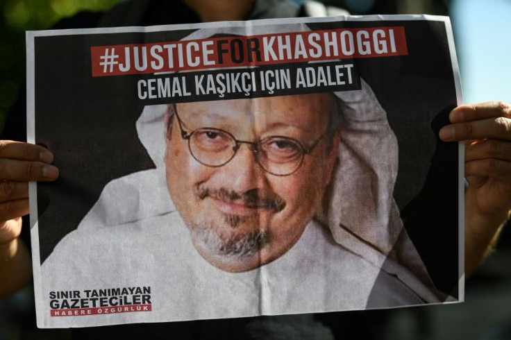 Friends of Saudi journalist Jamal Khashoggi hold posters bearing his picture in front of Saudi Arabia's Istanbul consulate where he was murdered, on the second anniversary of his killing in October 2020