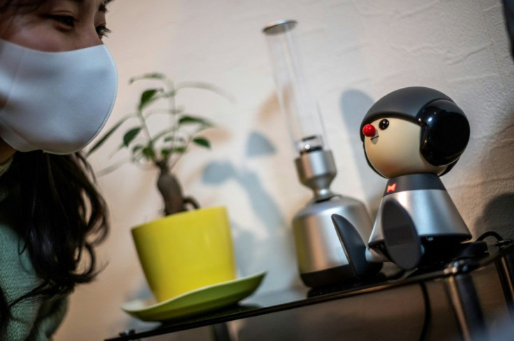 Nami Hamaura says she feels less lonely working from home thanks to her singing companion Charlie, a Japanese robot