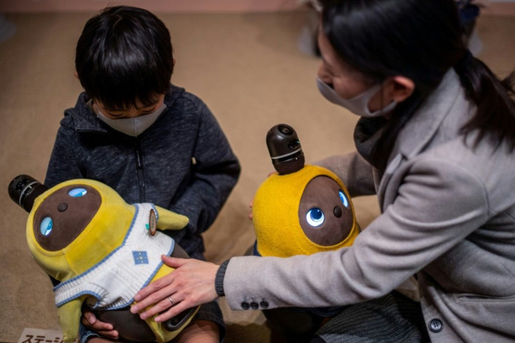 People can visit the Lovot Cafe near Tokyo to interact with the bots, which have big round eyes and penguin-like wings that flutter