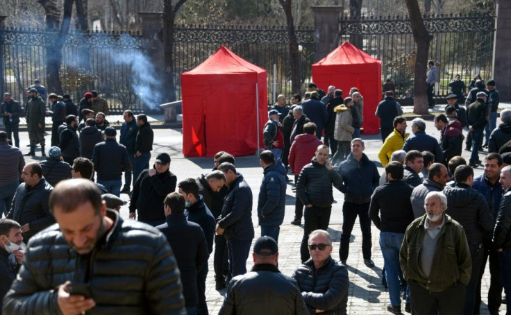 Opposition supporters gather near the National Assembly building during a protest demanding the resignation of Prime Minister Nikol Pashinyan over his handling of last year's war with Azerbaijan