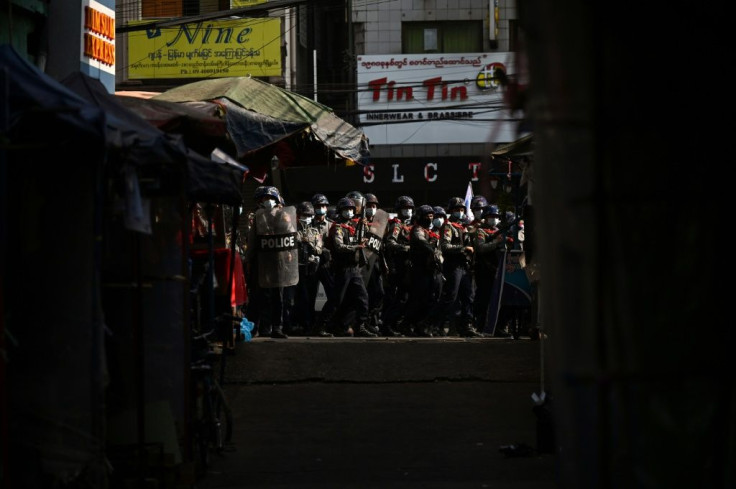 Police cleared away protesters holding a demonstration against the country's military junta in Yangon on Friday