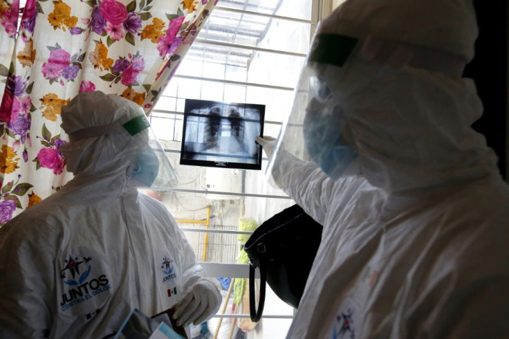 Mexican doctors look at an X-ray of the lungs of someone with Covid-19 in Juanacatlan in Jalisco state