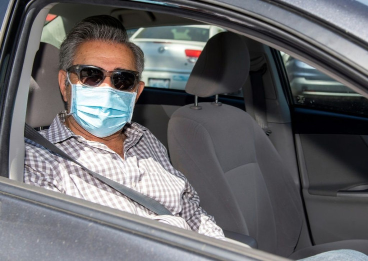 Actor Eugene Levy -- a Golden Globe nominee for his work on hit TV comedy "Schitt's Creek," seen here at a pre-gala drive-through "gifting suite" -- says the awards shows must go on