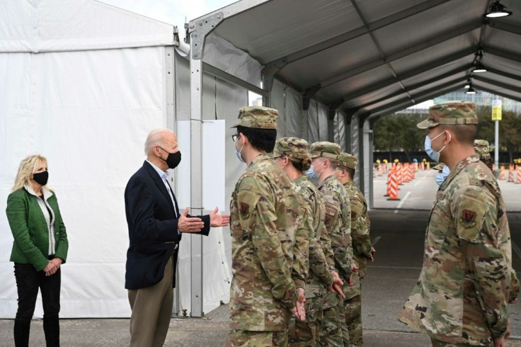 US President Joe Biden, shown here visiting a Covid vaccination facility in Houston, Texas on February 26, 2021, said he wants Congress to swiftly pass the pandemic relief package to help millions of American families