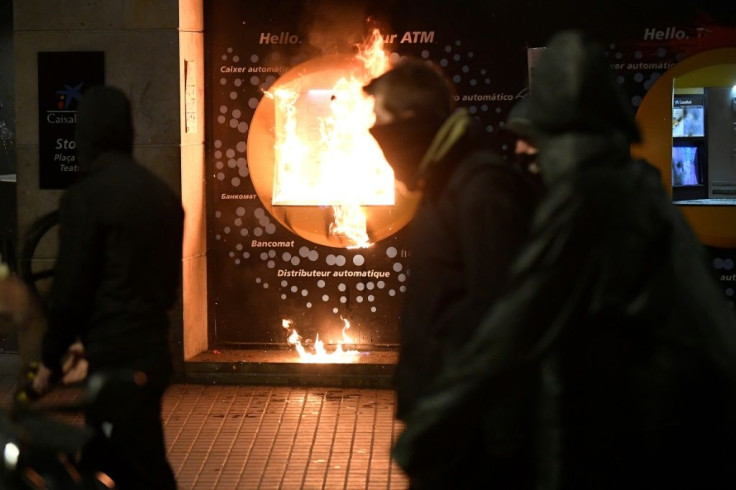 A burning cash machine in Barcelona during the protest