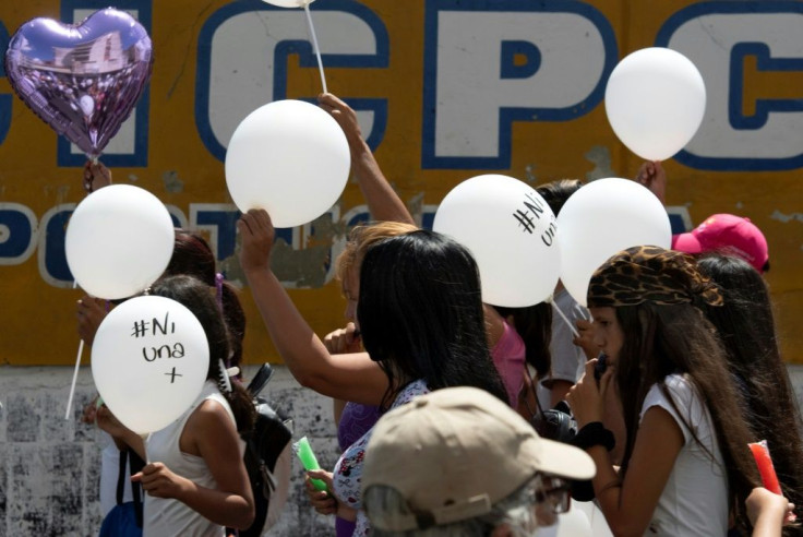 Women and men, many holding ballongs, marched peacefully in the northern city of Acarigua, as drivers honked horns in support