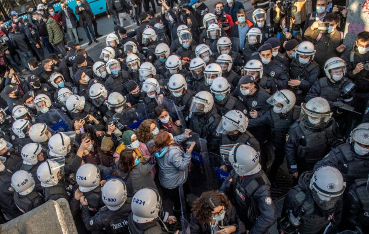 Turkish police officers detain protestors during a rally in support of Bogazici University students protesting against the appointment of a ruling Justice and Development Party (AKP) loyalist as rector on February 4, 2021