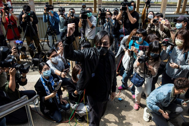 Hong Kong pro-democracy activist Mike Lam (C) was among the activists charged on Sunday