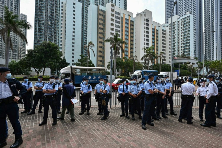 Large numbers of police stood guard outside the West Kowloon court in Hong Kong during court appearances by dozens of dissidents