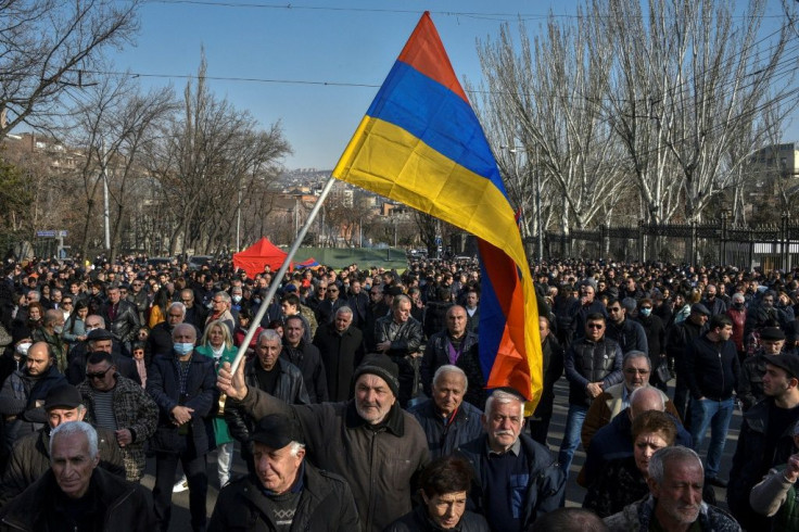 Opposition supporters rallied Saturday outside the National Assembly building to demand the Prime Minister's resignation over his handling of last year's war with Azerbaijan