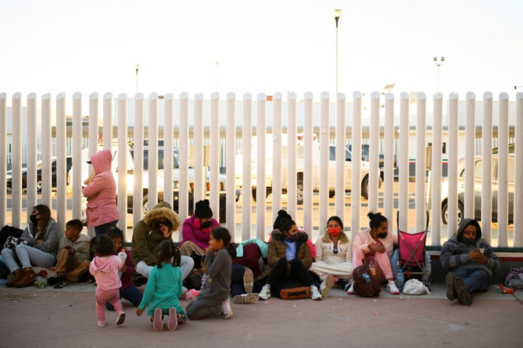 Asylum seekers wait outside the El Chaparral border crossing in Tijuana, Mexico hoping to be able to cross into the United States