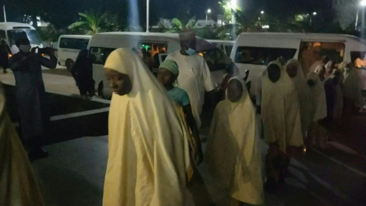 Girls wearing hijabs gathered at Zamfara state government premises as all 279 students kidnapped from their boarding school in northern Nigeria have been released.