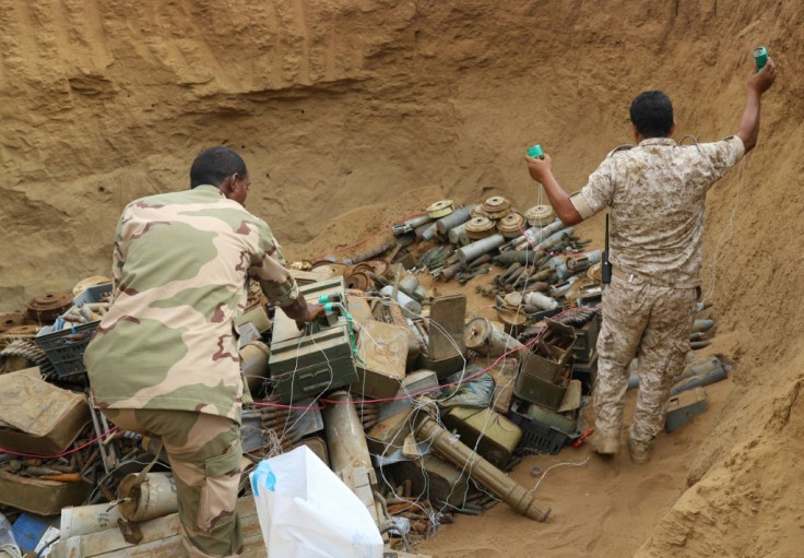Saudi-backed Sudanese and Yemeni military experts deactivate landmines allegedly placed by Huthi rebels in January 2021in Yemen's northern coastal town of Midi