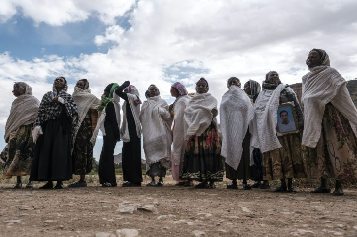 Women gather to mourn the victims of a massacre allegedly perpetrated by Eritrean soldiers in the village of Dengolat, north of Mekele, the capital of Tigray, on February 26, 2021