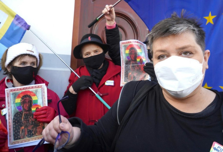 Elzbieta Podlesna, right, told AFP she was crossing her fingers that the church would change