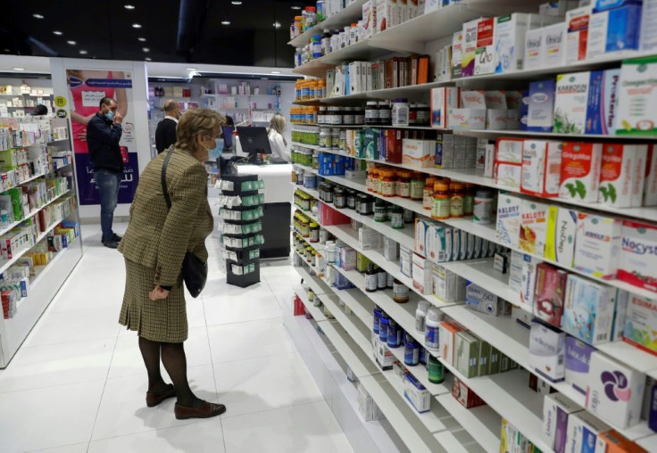 Customers browse the aisles for medicine at a pharmacy in the Lebanese capital Beirut in this file picture taken on February 2, 2021