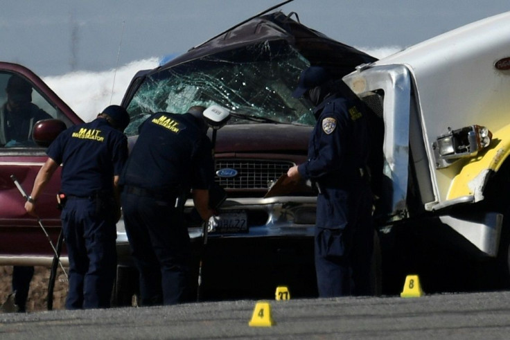 Investagators inspect the crash between an SUV and semi-truck near Holtville, California on March 2, 2021