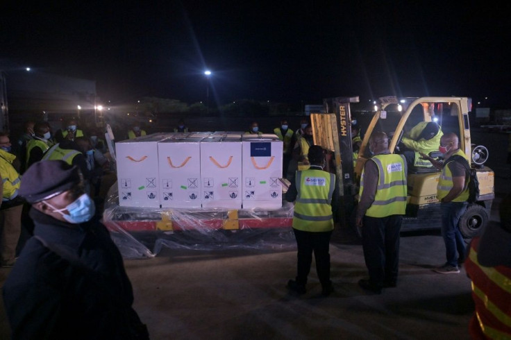 Some of the first batches of the Covid-19 vaccines arrive in Kenya to be loaded onto temperature-controlled trucks for transportation to a cold-storage facility in Nairobi