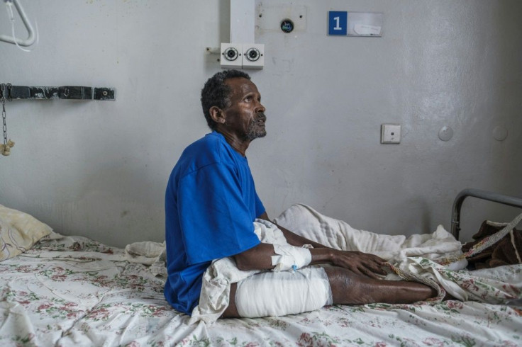 Tamrat Kidanu said he lay motionless after being shot as he heard Eritrean troops massacring his son and other men in Dengolat