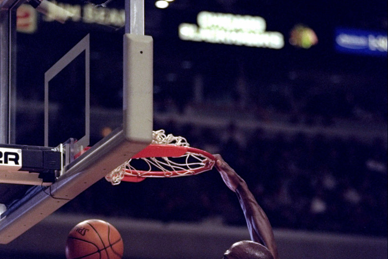 Michael Jordan of the Chicago Bulls (right) in action forward Brian Williams of the Detroit Pistons