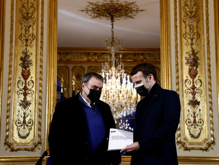 French President Emmanuel Macron (R) meets in January at the Elysee Palace with historian Benjamin Stora for a report on France's colonisation of Algeria and the Algerian War for independence.