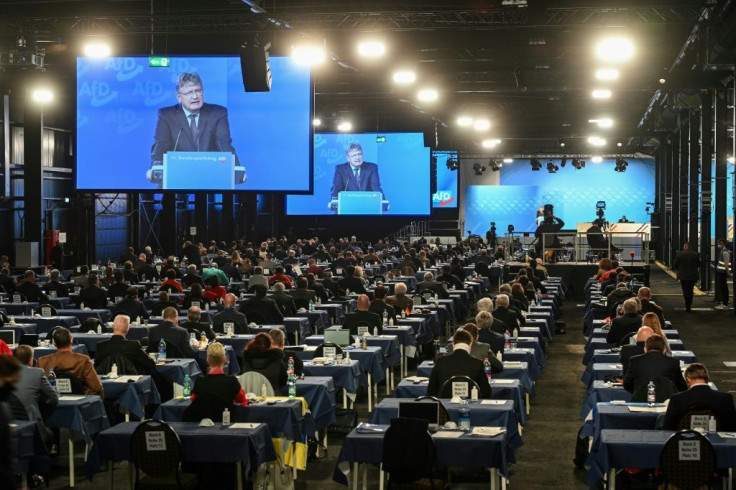 Joerg Meuthen, co-leader of the AfD, is seen on video screens during his speech at the party congress of far-right party in November 2020