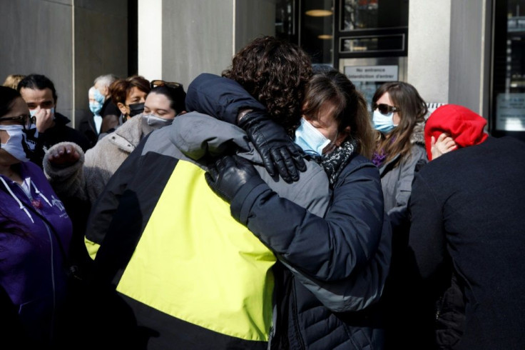 Family and friends of victims of the 2018 deadly van attack embrace as they gather outside the Toronto courthouse following the issuing of the ruling
