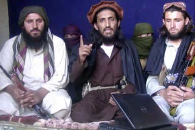 In this image taken from a video recording, Pakistan Taliban commander, gives an interview in Pakistan's Mohmand tribal region