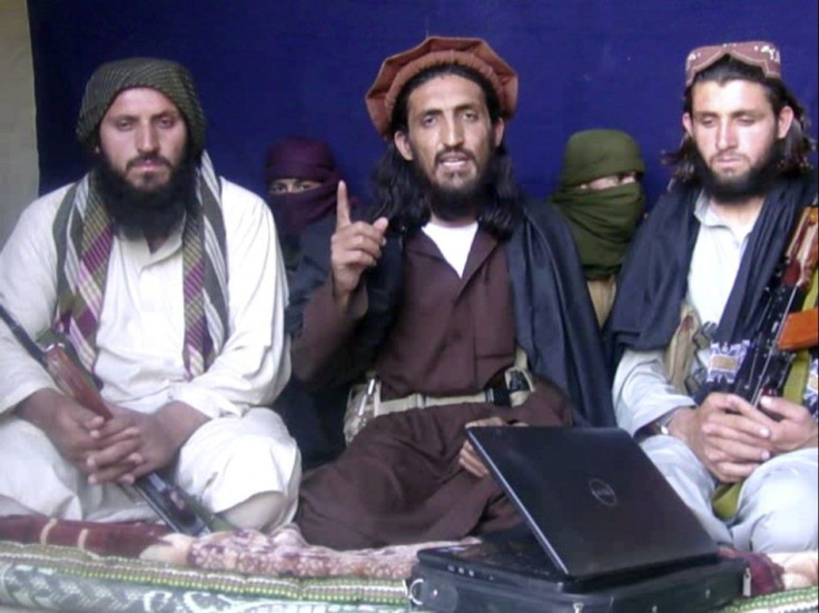 In this image taken from a video recording, Pakistan Taliban commander, gives an interview in Pakistan's Mohmand tribal region