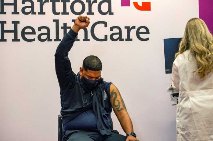 Public school safety officer Victor Rodriguez celebrates after receiving the Johnson & Johnson Covid-19 Vaccine at Hartford Hospital. Connecticut, on March 3, 2021