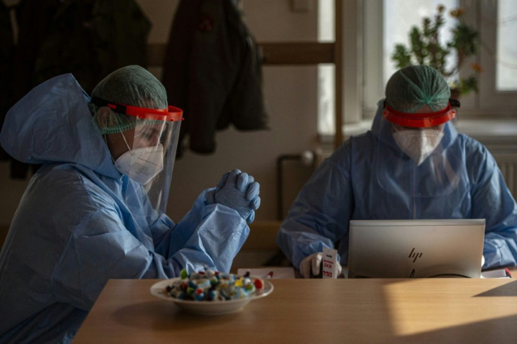 Czech soldiers wearing protective equipment (PPE) wait for patients at a testing station in Chodova Plana town, western Bohemia, on March 3, 2021, during the ongoing coronavirus (Covid-19) pandemic