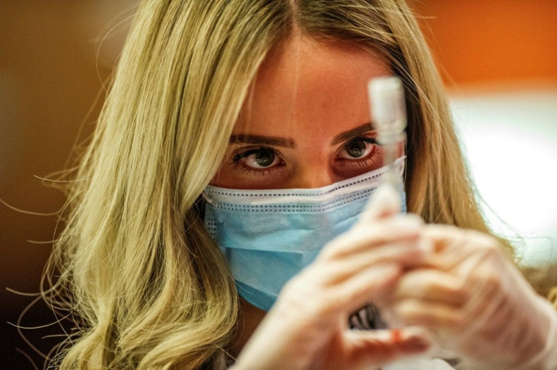 Pharmacist Madeline Acquilano fills a syringe with the Johnson & Johnson Covid-19 vaccine in the US state of Connecticut