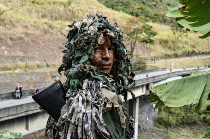 Ismaira Figueroa, a sniper for the Bolivarian militia, poses while taking part in military exercises for the "Bolivarian Shield 2020 Operation" in Caracas