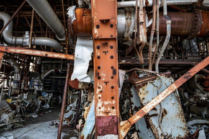 Tangled scrap metal can still be seen strewn around parts of the reactor site