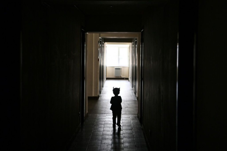 A child walks in a university student residence in Yerevan used for people who were displaced during the war between Azerbaijan and Armenia in 2020