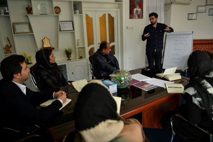 Afghan women working with aid groups say they have been blocked from entering insurgent-held enclaves by the Taliban