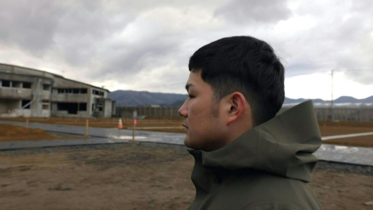 Yuto Naganuma looks silently as the cold sea breeze sweeps over the crumbling walls of the school where his little brother was lost in Japan's devastating 2011 tsunami.Ten years on, Naganuma and others like him form a generation whose young lives were s