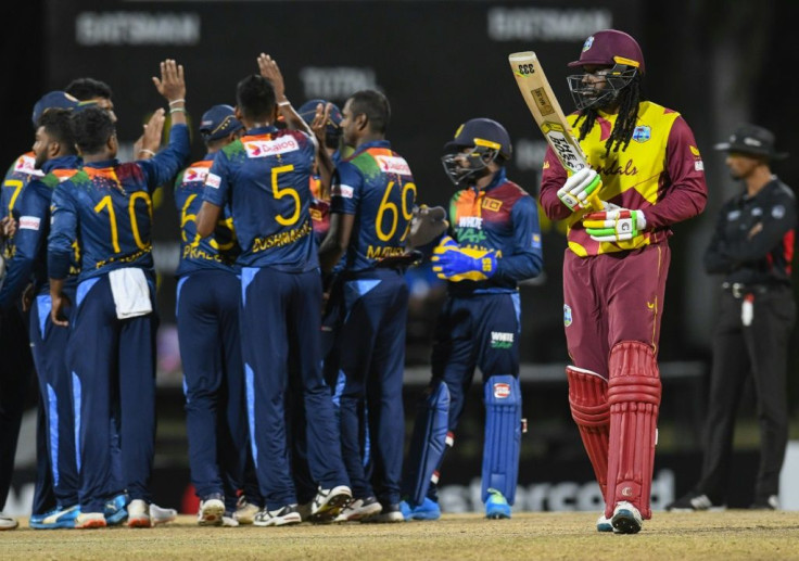 Sri Lanka celebrate bagging the wicket of Chris Gayle for nought, out first-ball