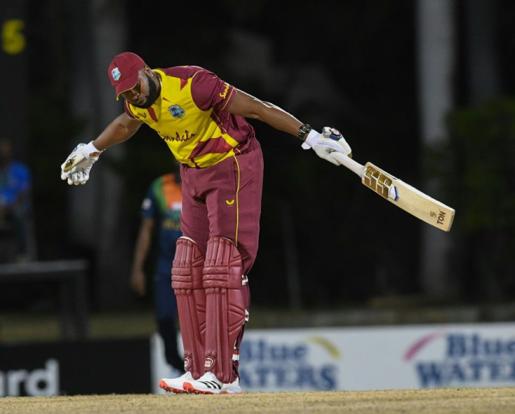 Six of the best: Kieron Pollard of the West Indies takes a bow after hitting six sixes off one over from Sri Lanka's Akila Dananjaya