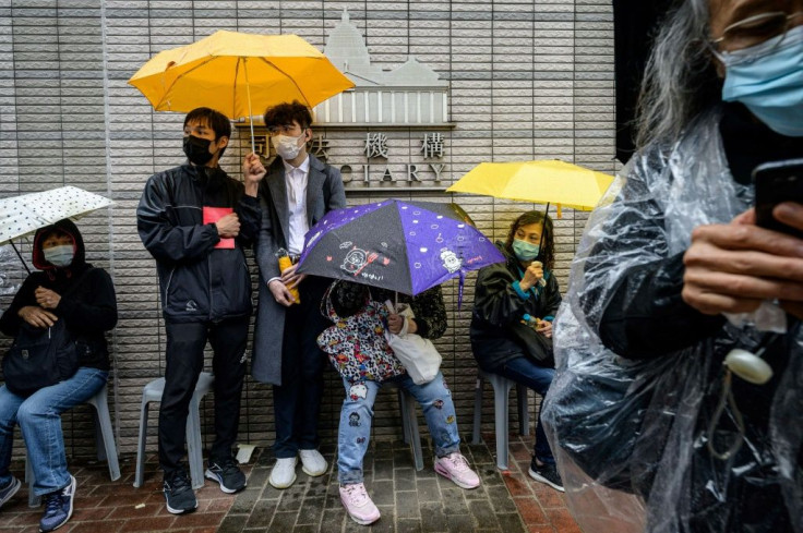 Supporters lined up in the rain outside the Hong Kong court awaiting the end of a marathon bail hearing