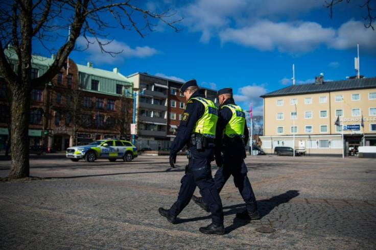 Police officers patrol Vetlanda a day after the stabbing attack