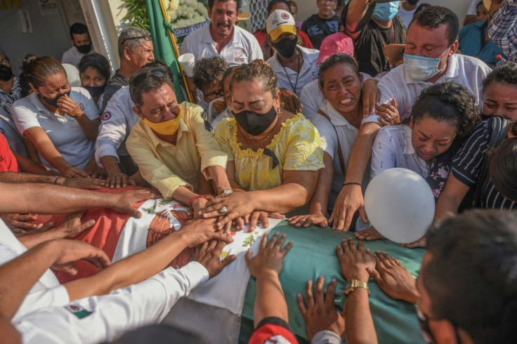 Relatives and friends mourn Florisel Rios, a mayor who was murdered in Mexico's eastern Veracruz state in November 2020