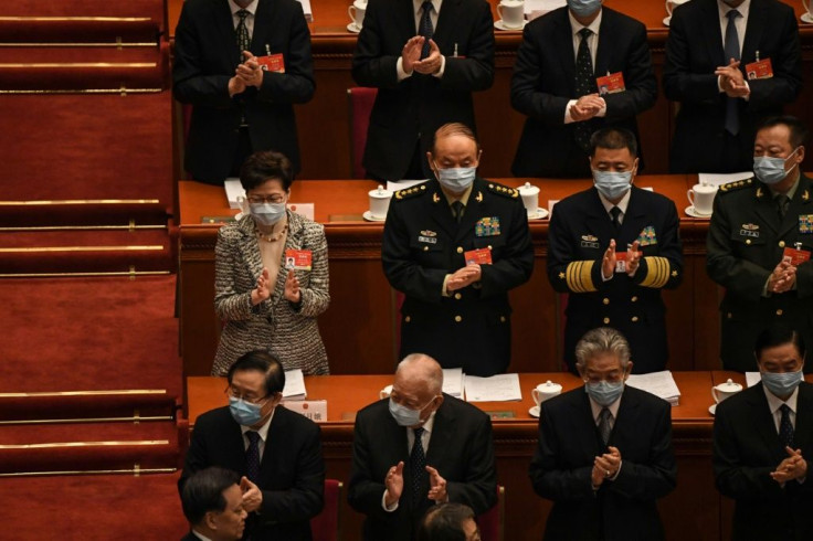 Hong Kong's Chief Executive Carrie Lam (L-centre row) attends the opening session of the National People's Congress (NPC) at the Great Hall of the People in Beijing